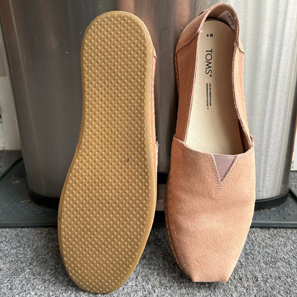 Tom’s slip on shoes.